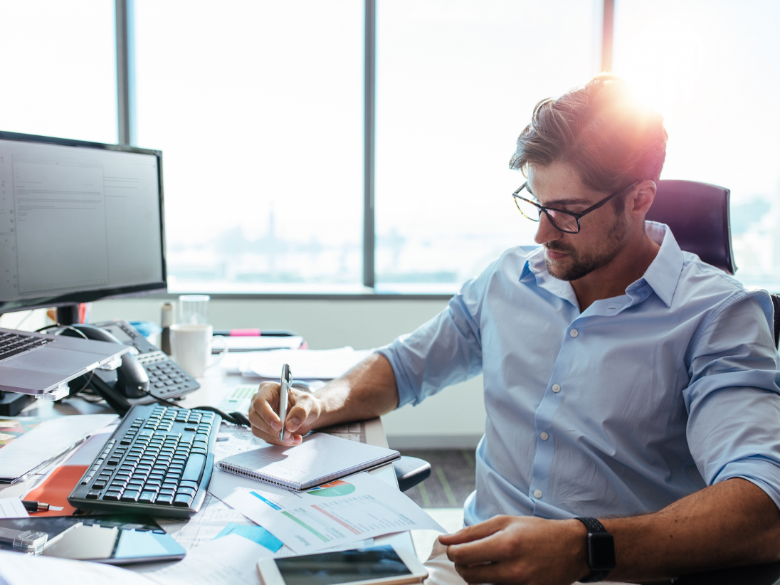 IMAGE: Underwriter at desk